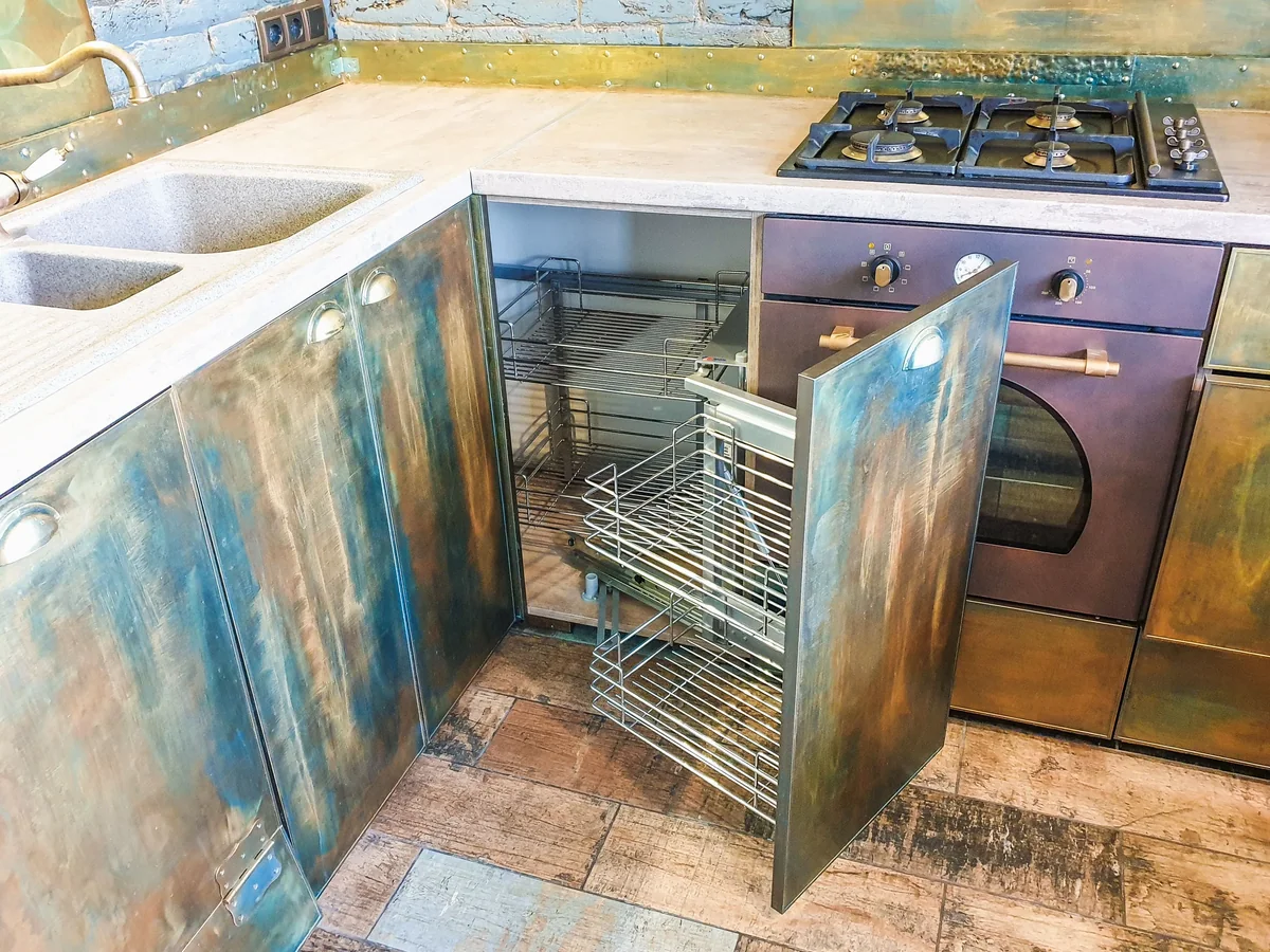 Marine-grade cabinet door and stainless hardware on a covered outdoor kitchen run