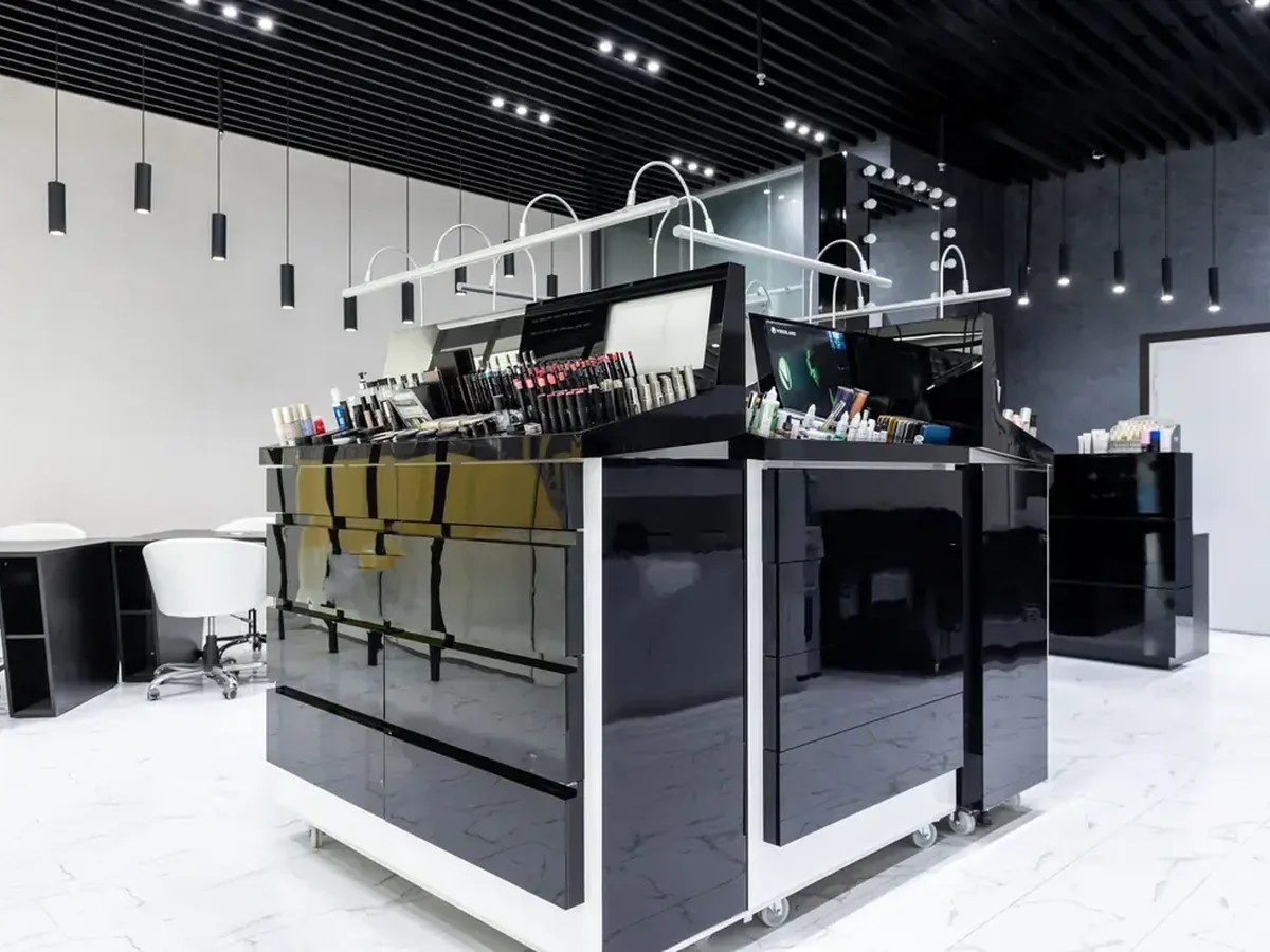 Lit glass display case and adjustable merchandising shelving in a custom retail fixture