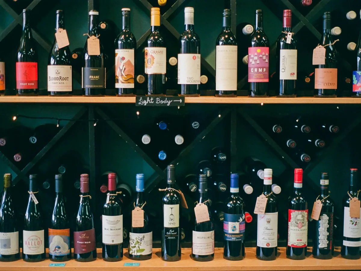 Individual bottle cradles in solid wood wine racking built for a controlled-humidity cellar